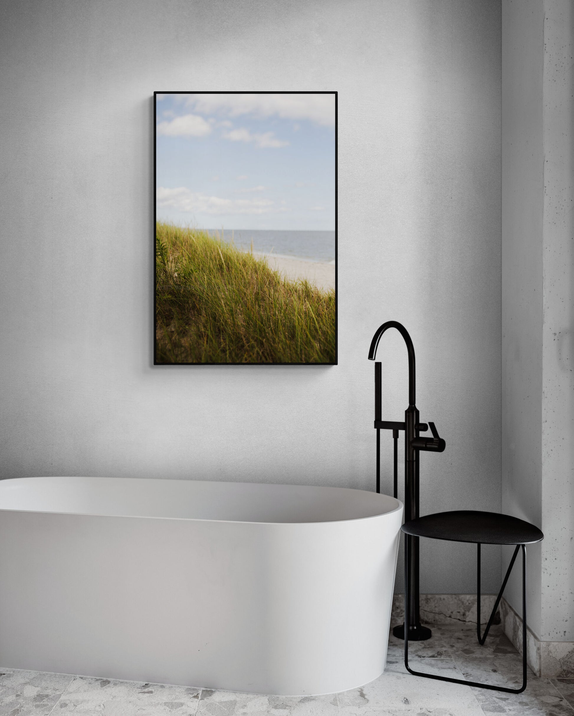 Beach photograph with seagrass, sand and water in a bathroom as wall art