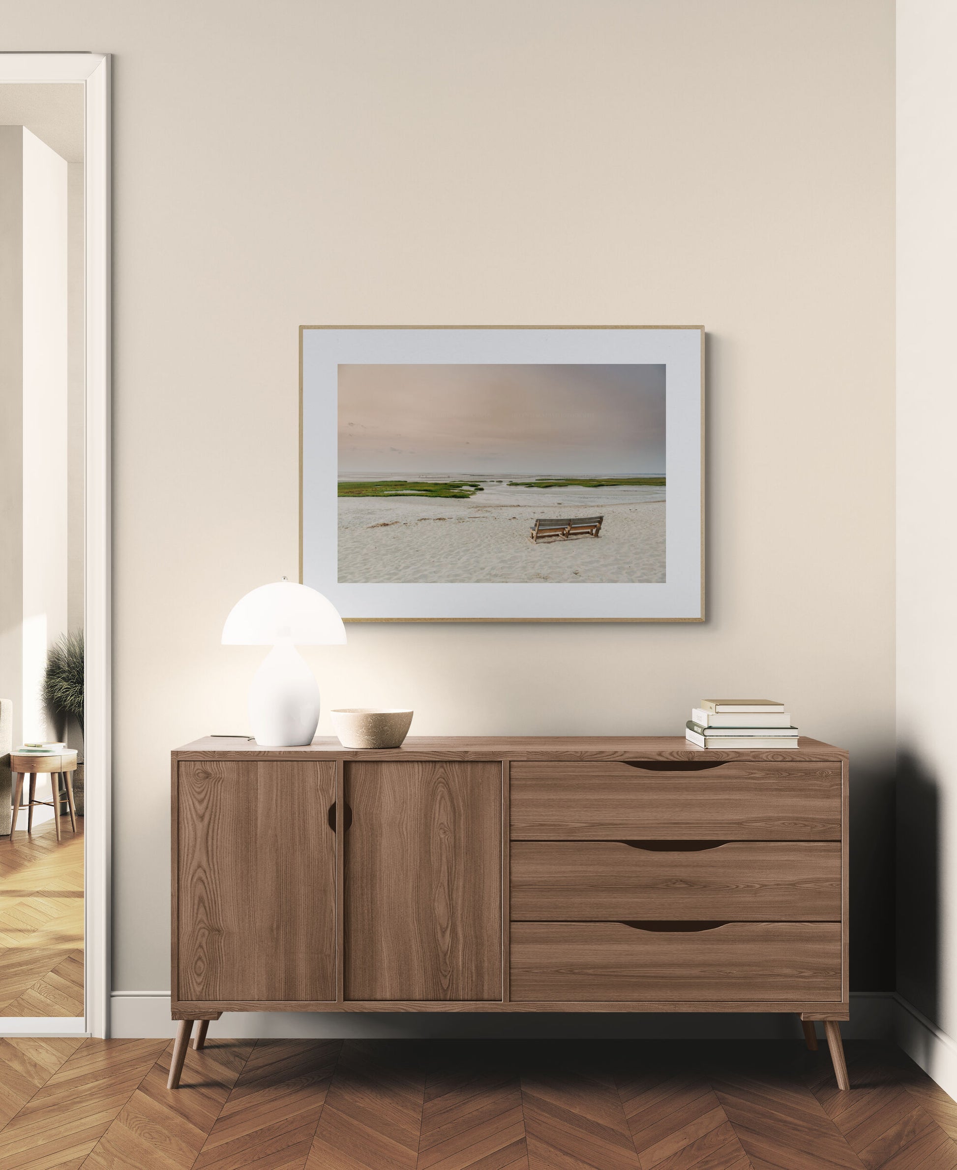 Beach photograph of bench at sunset and low tide in dining room