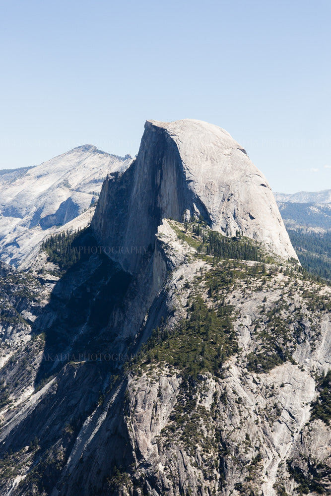 Photograph of Half Dome in Yosemite National Park with clear blue sky