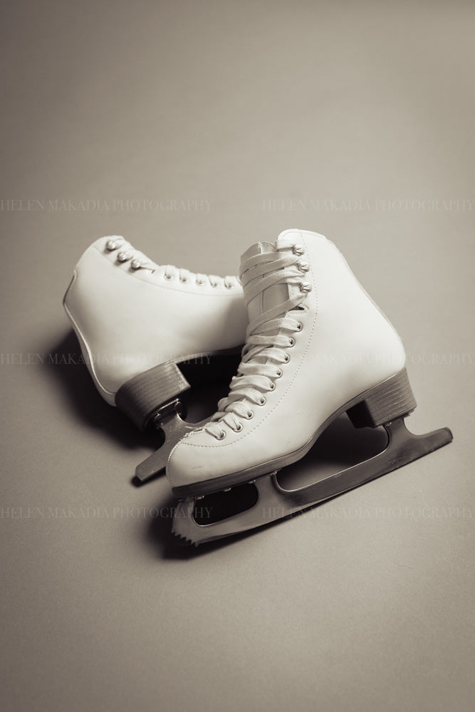 A pair of white ice skates 