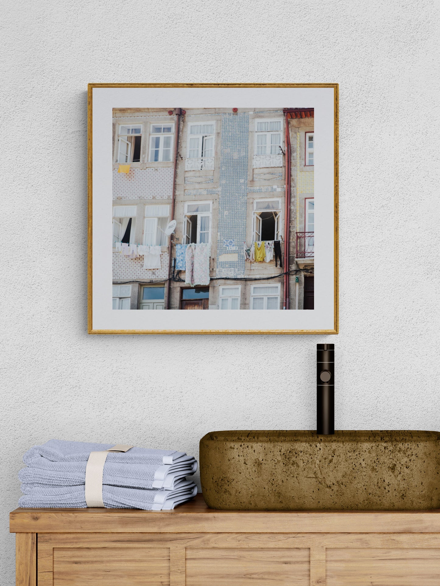 Laundry on a clothesline in Porto Portugal with windows and balconies in bathroom