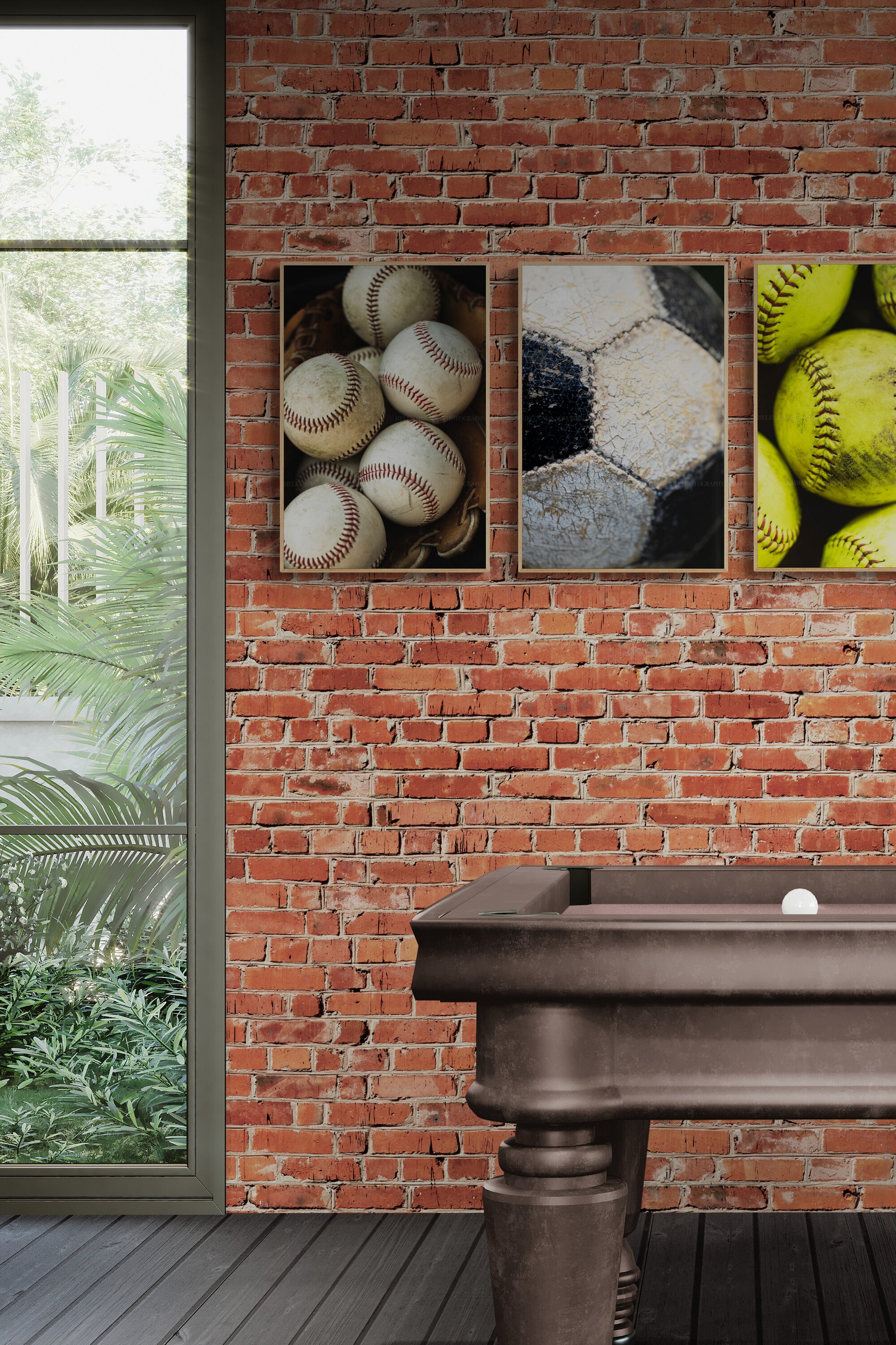Sports themed room inspo with soccer ball, baseballs and softball photographs as wall art.
