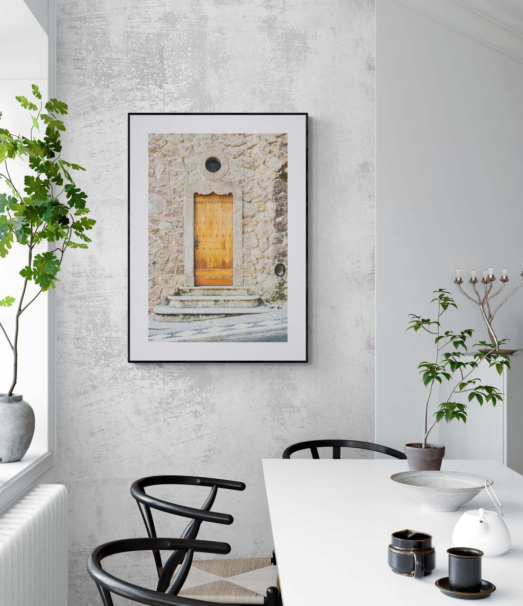 Wooden door photograph of sintra portugal as wall art in a dining room