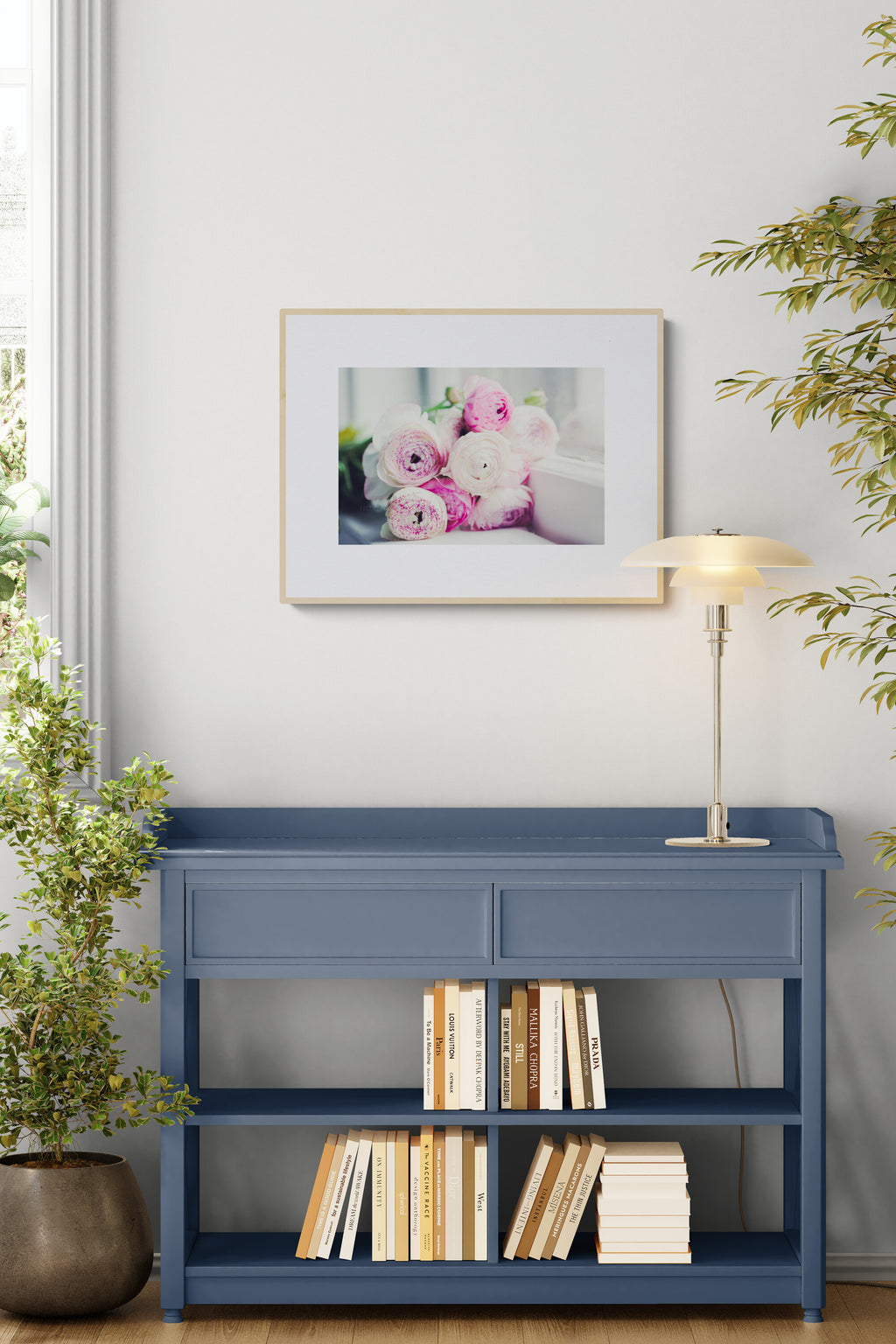A photograph of lavender pink ranunculus flowers in a study as calming wall art decor.