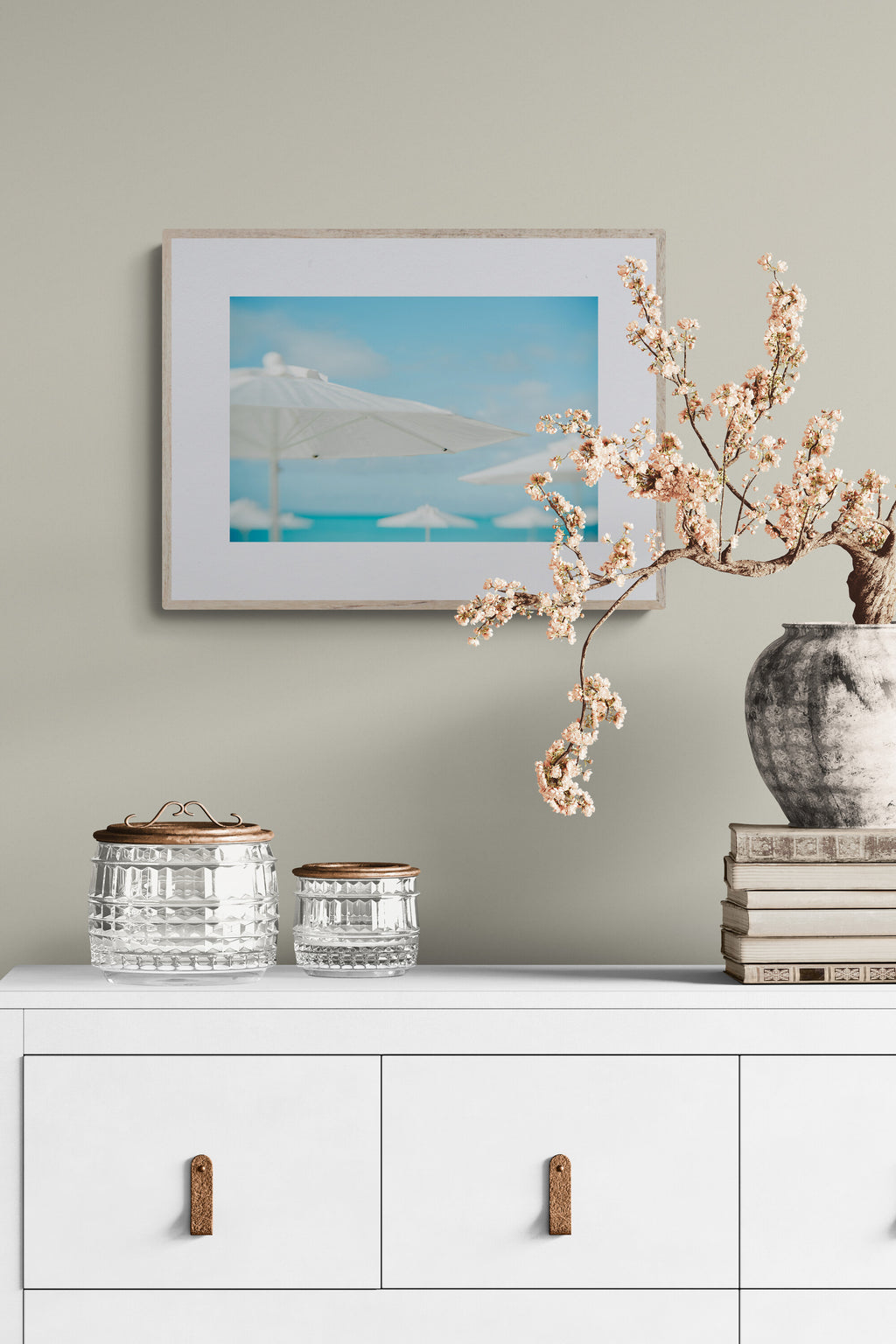 A photograph of white umbrellas on the beaches of turks and caicos as living room wall art.