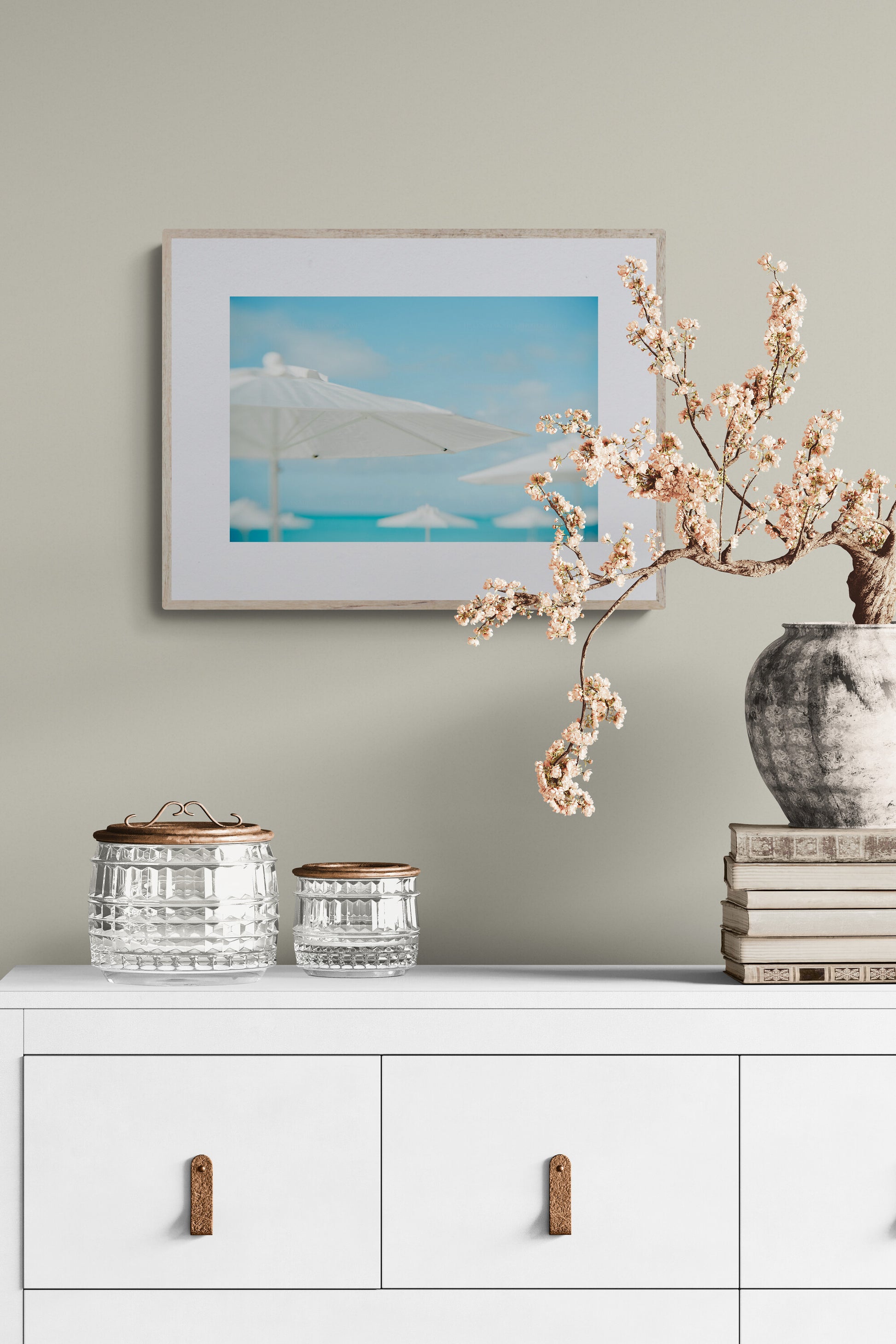 A photograph of white umbrellas on the beaches of turks and caicos as living room wall art.