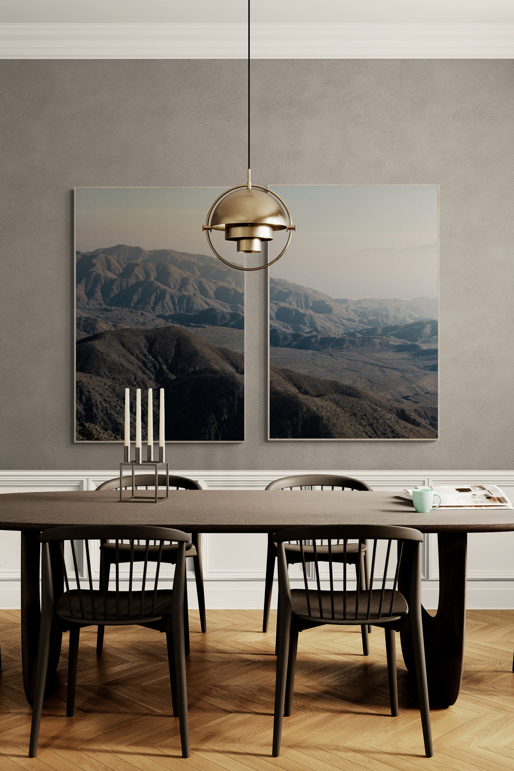 A set of two nature mountain photographs as wall art in a dining room