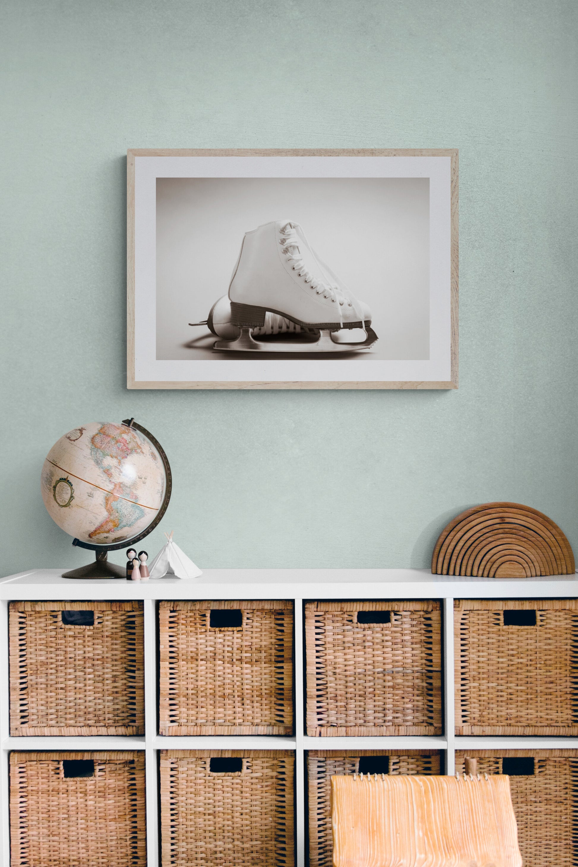A photograph of white figure skates in a room as wall art decor