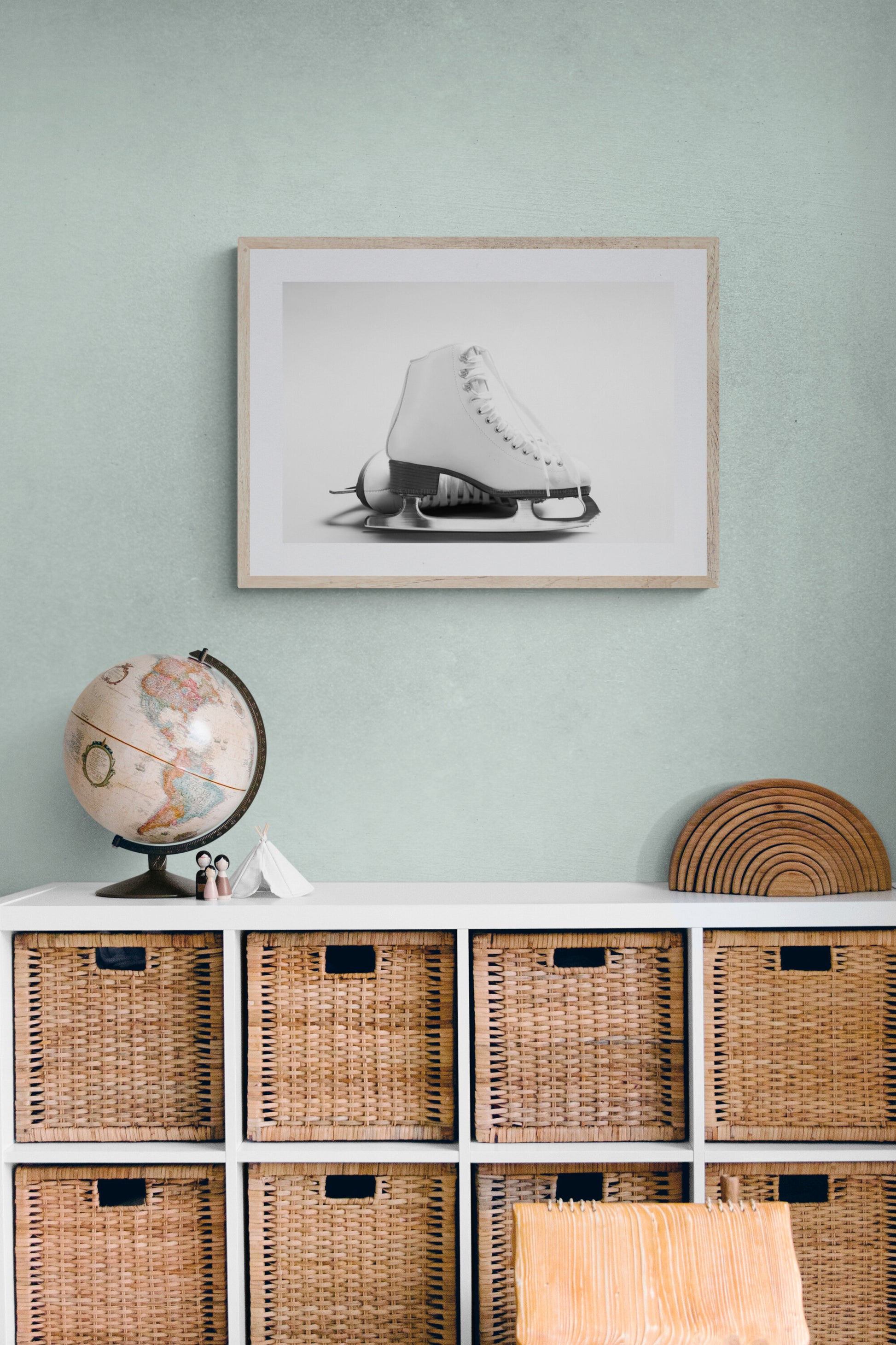 A photograph of white figure stajes as wall decor in a children's playroom