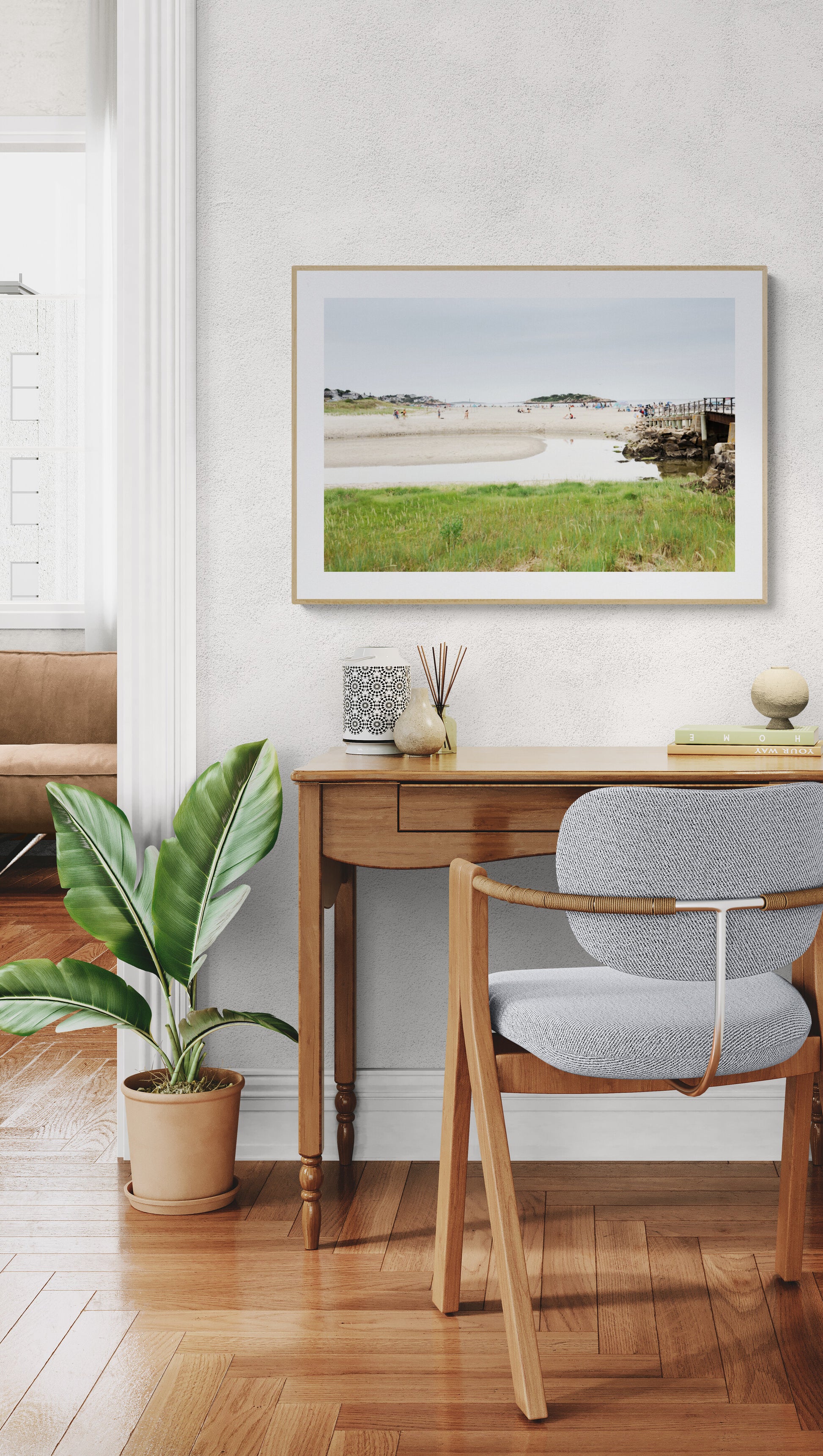 Framed photograph of good harbor beach in gloucester as wall art in a home office