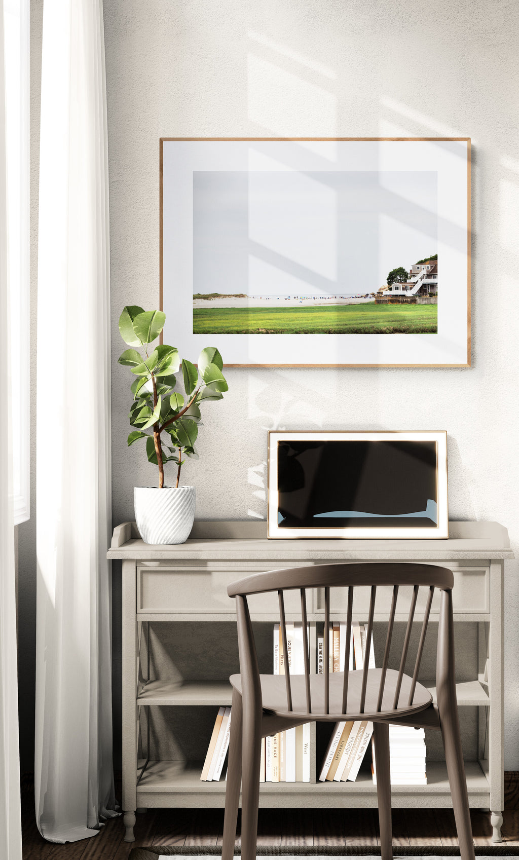 Framed Photograph of Good Harbor Beach and the pier in Gloucester MA in a home office as wall art decor. 