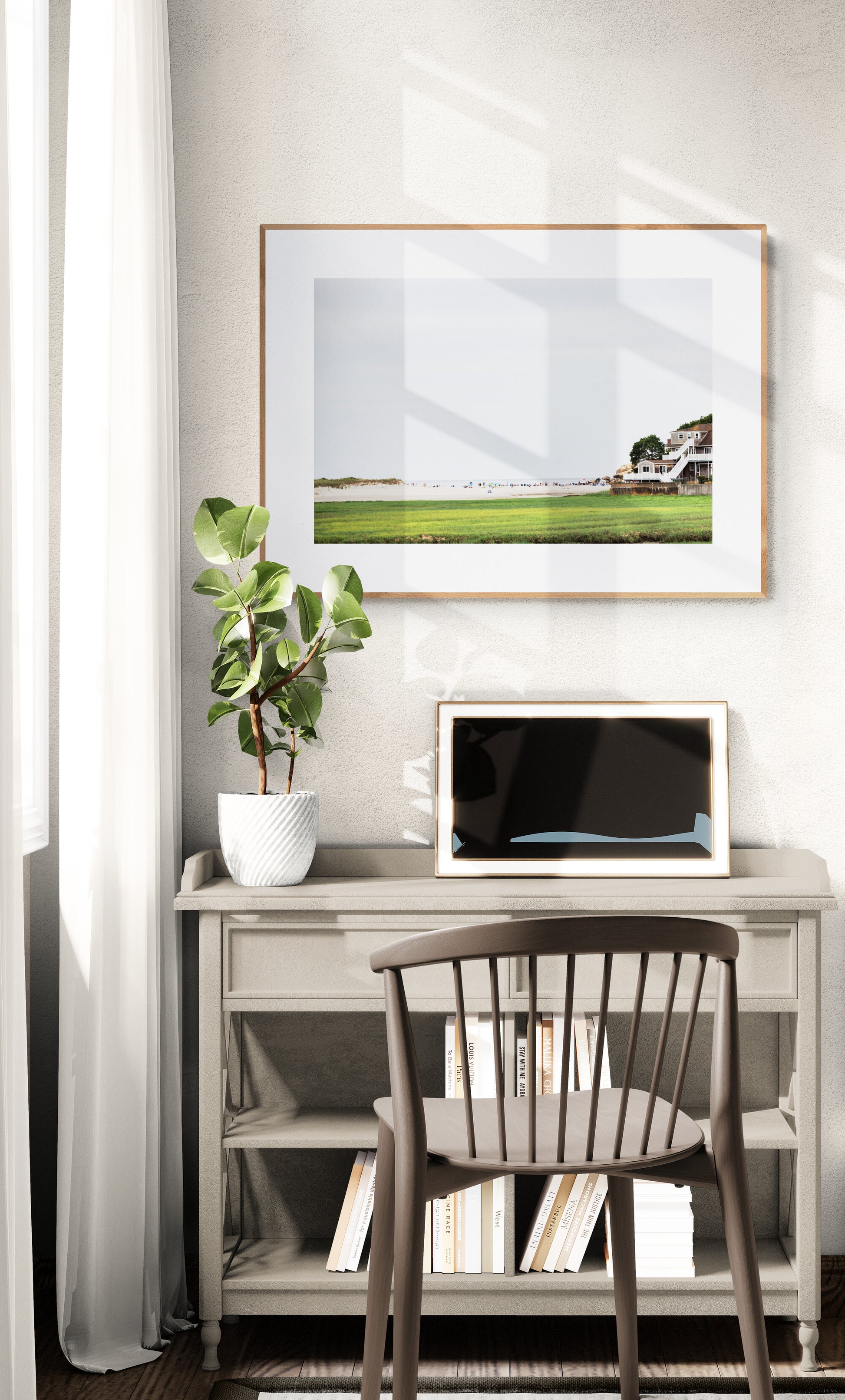 Framed Photograph of Good Harbor Beach and the pier in Gloucester MA in a home office as wall art decor. 