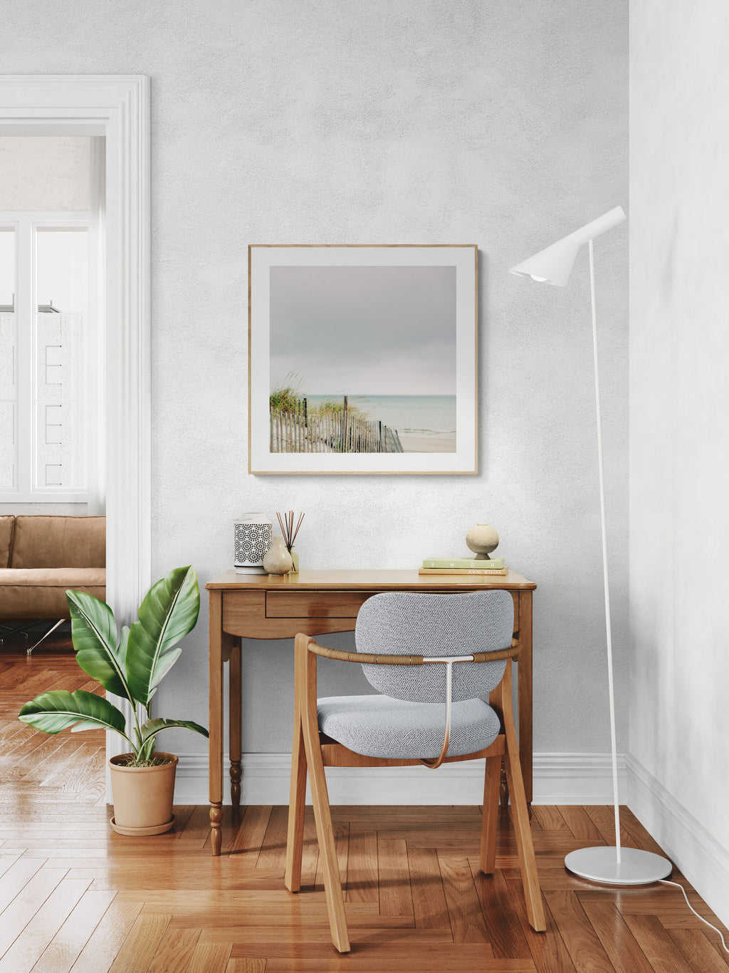 A peaceful beach print scene in a home office.
