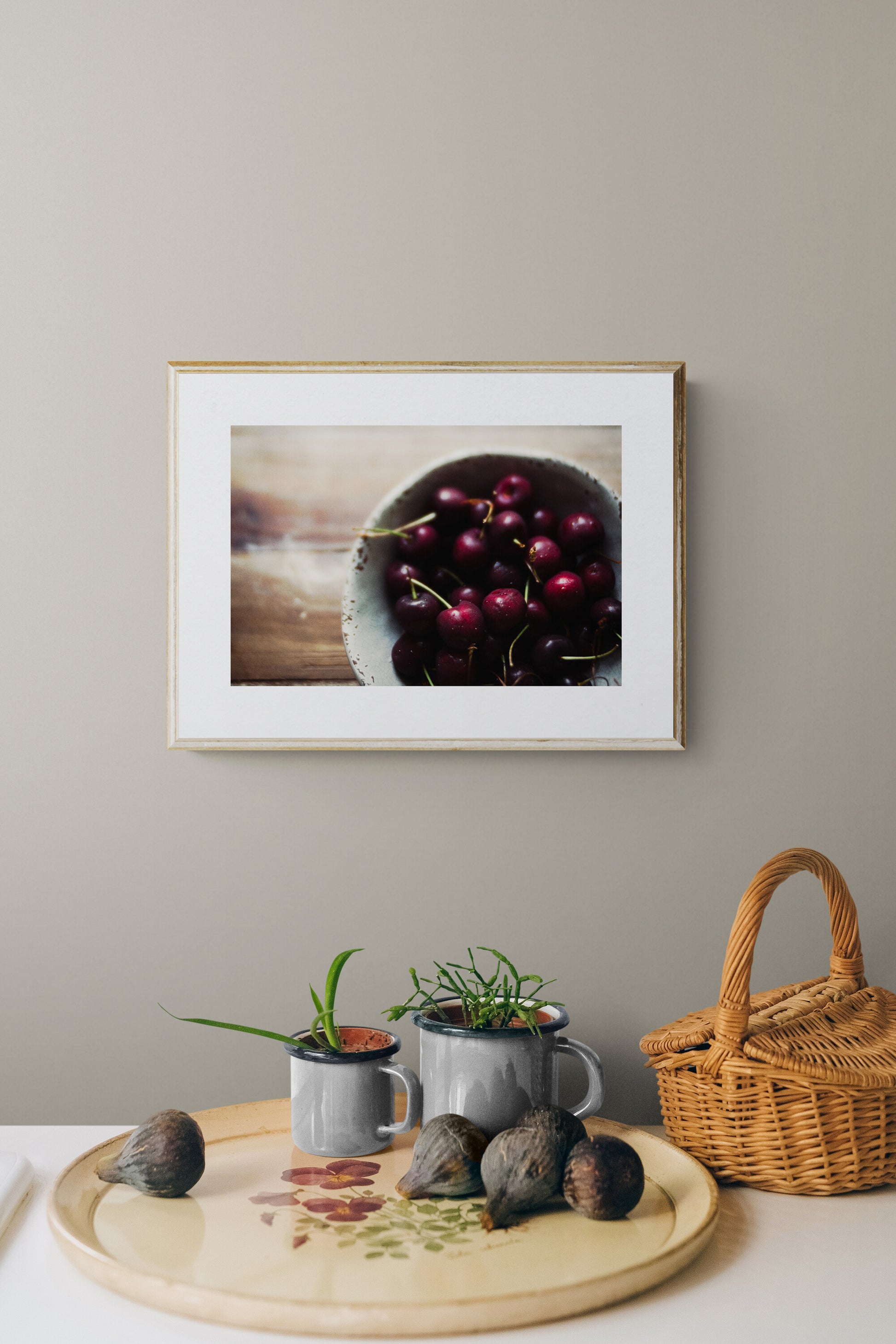 photograph of red cherries as kitchen wall art in a kitchen