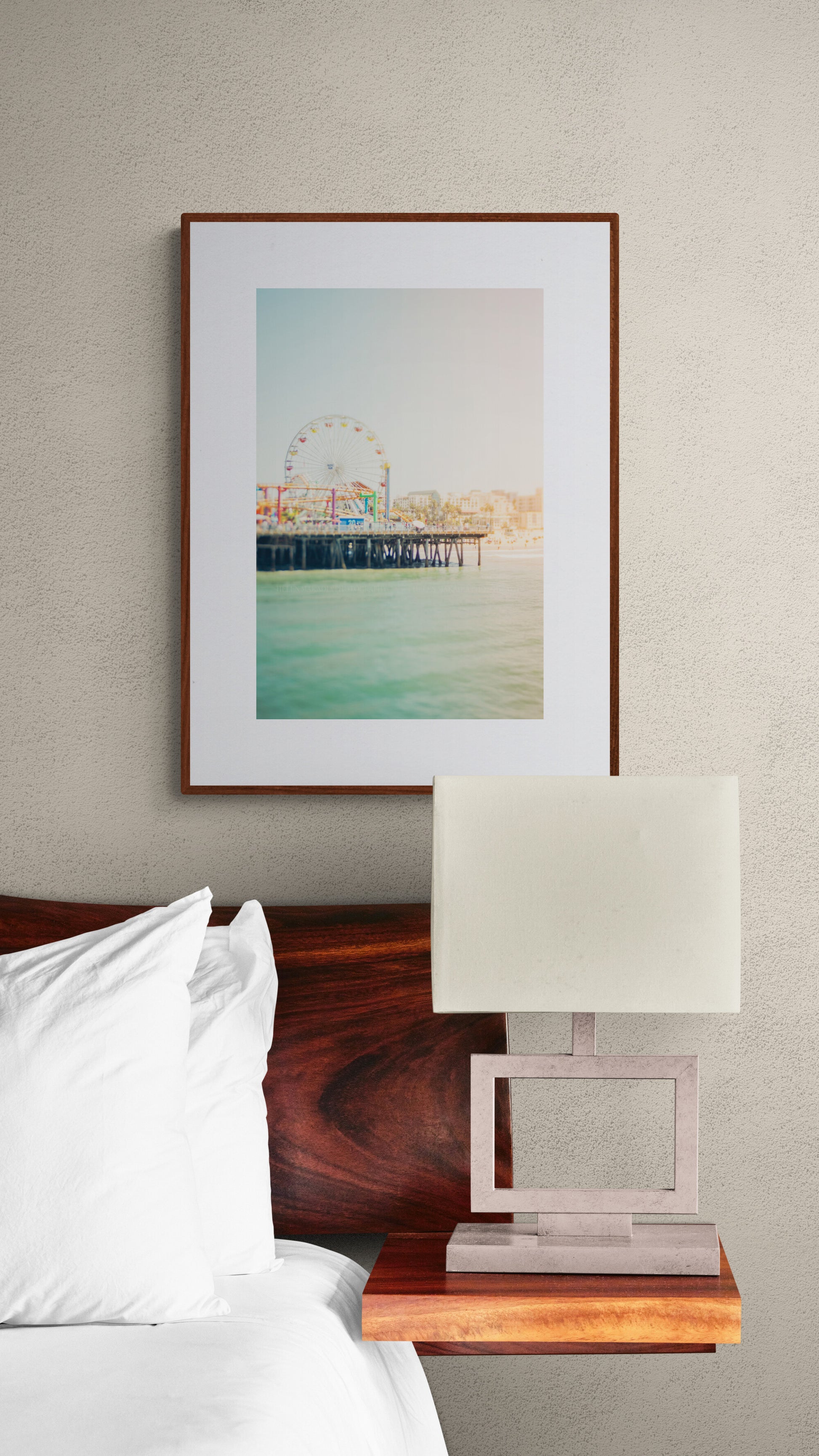 Framed photograph of the Santa Monica Pier in a bedroom