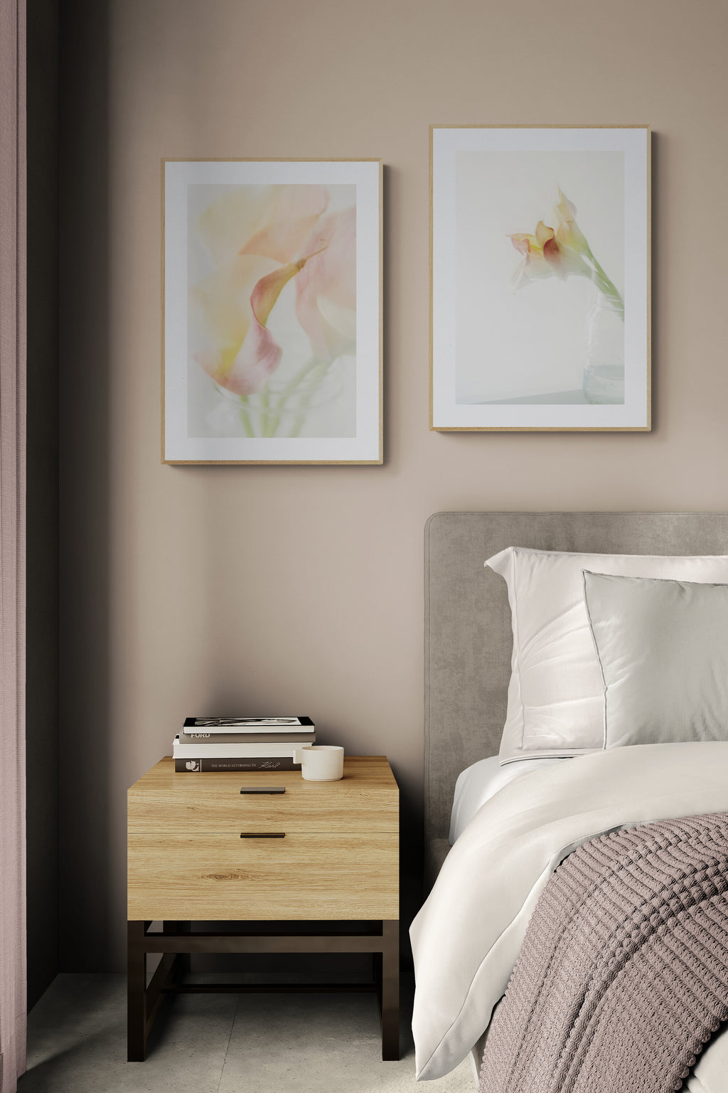A set of two photographs of calla lilies as wall art in a bedroom
