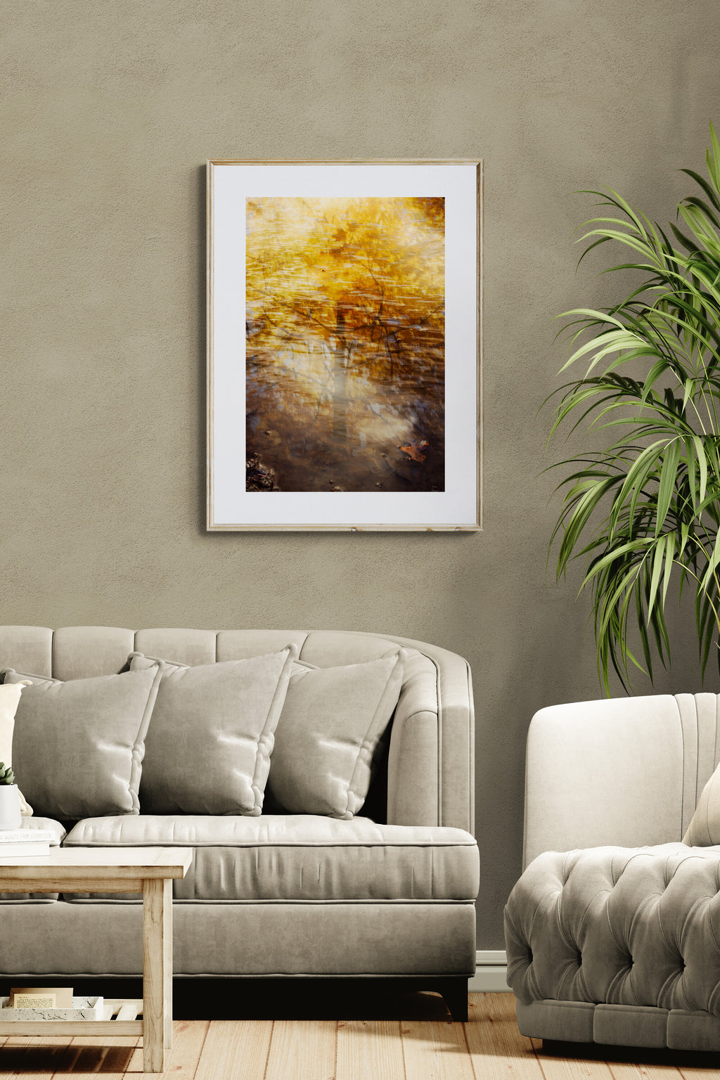 Living room with an abstract photograph of reflections with a golden maple tree as wall art in a living room