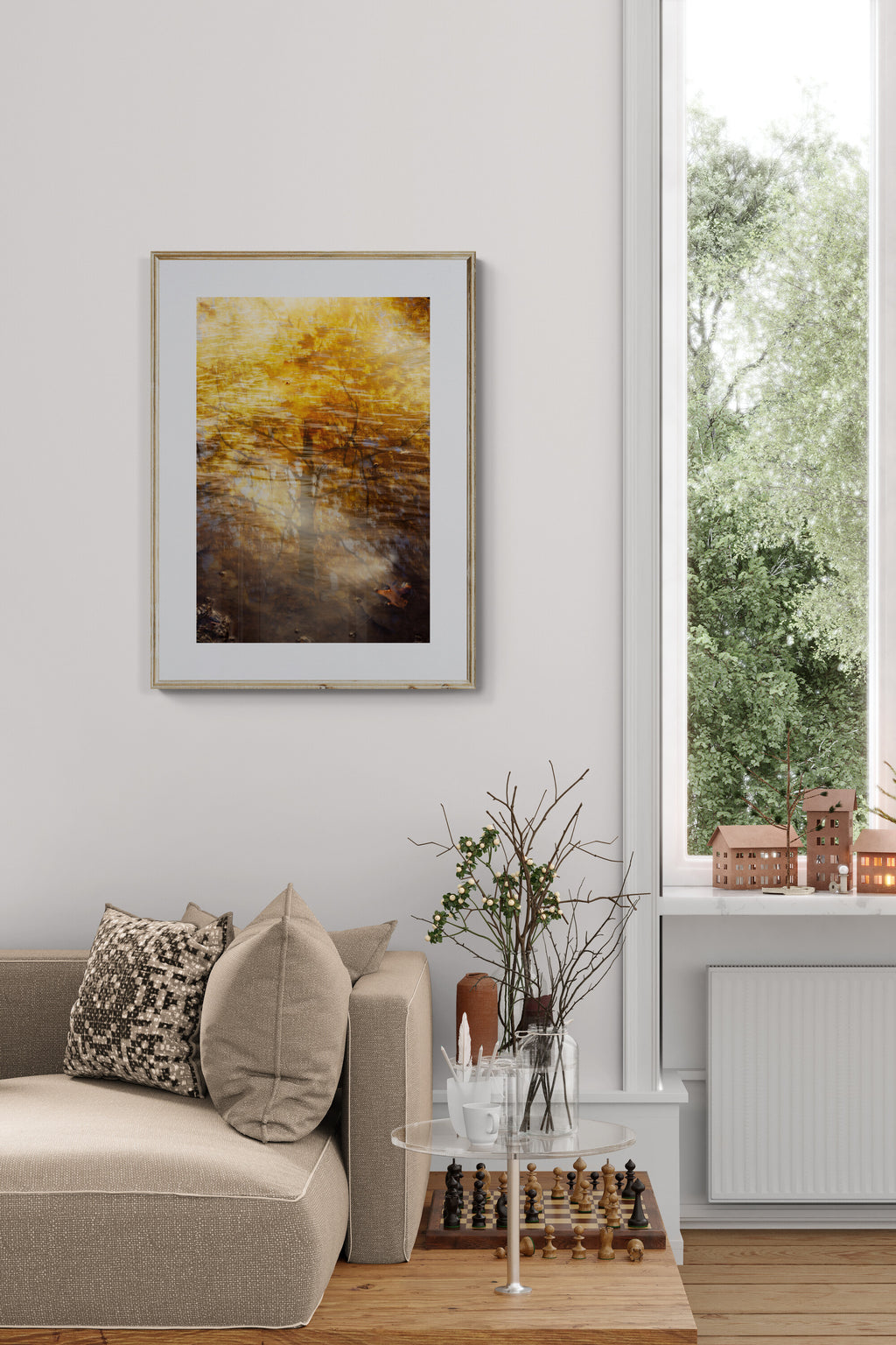 Living room with an abstract photograph of reflections with a golden maple tree as wall art in a living room