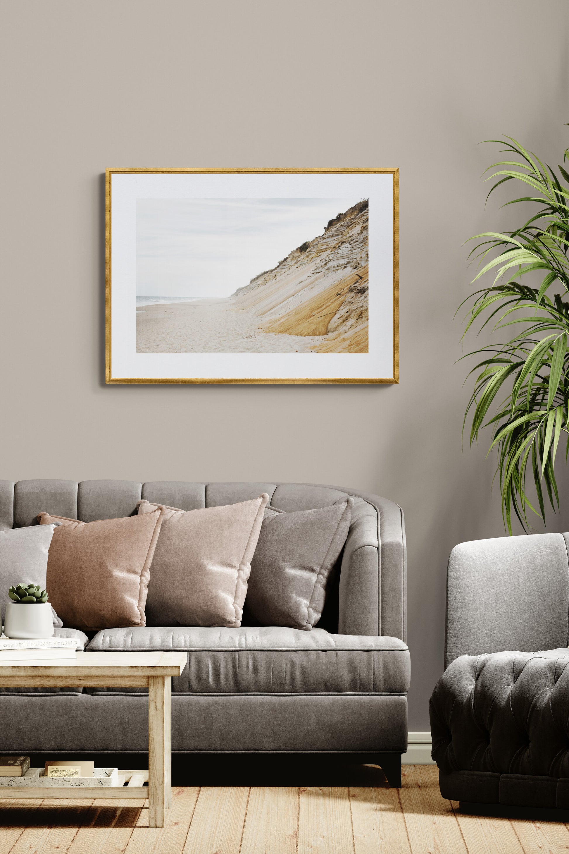 A landscape Cape Cod photograph of sand dunes and oceanas wall art in a living room