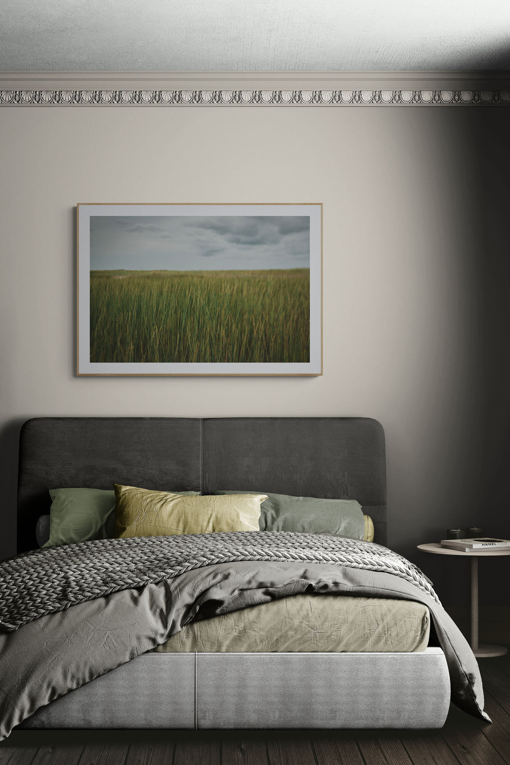 A photograph of sea grass near the beach in a bedroom as wall art.