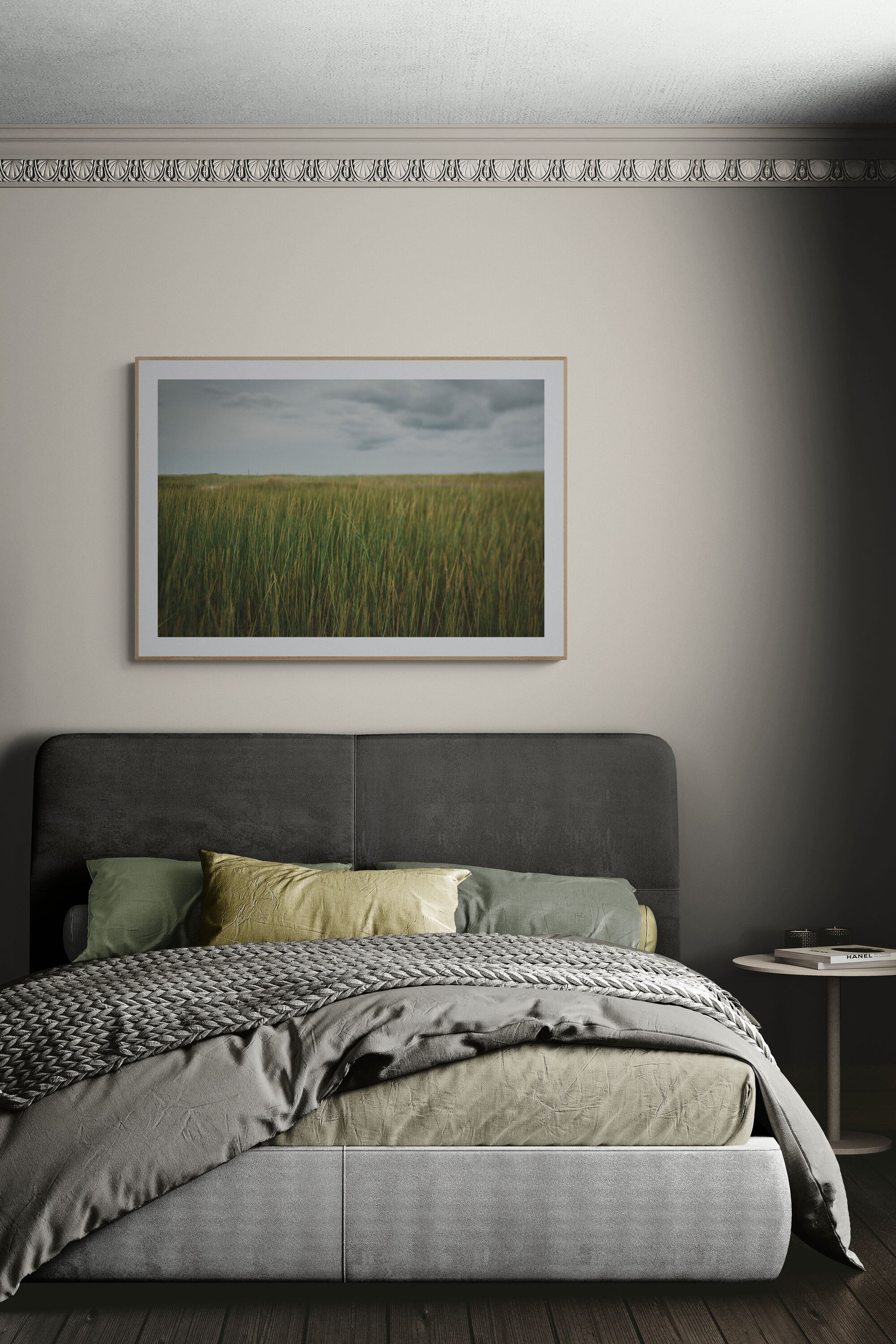 A photograph of sea grass near the beach in a bedroom as wall art.