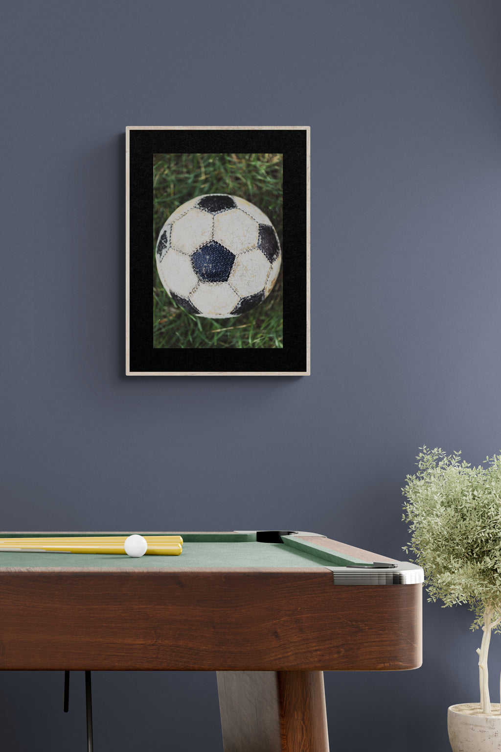 Soccer ball photograph as wall art inspo in a sports teen hangout room.