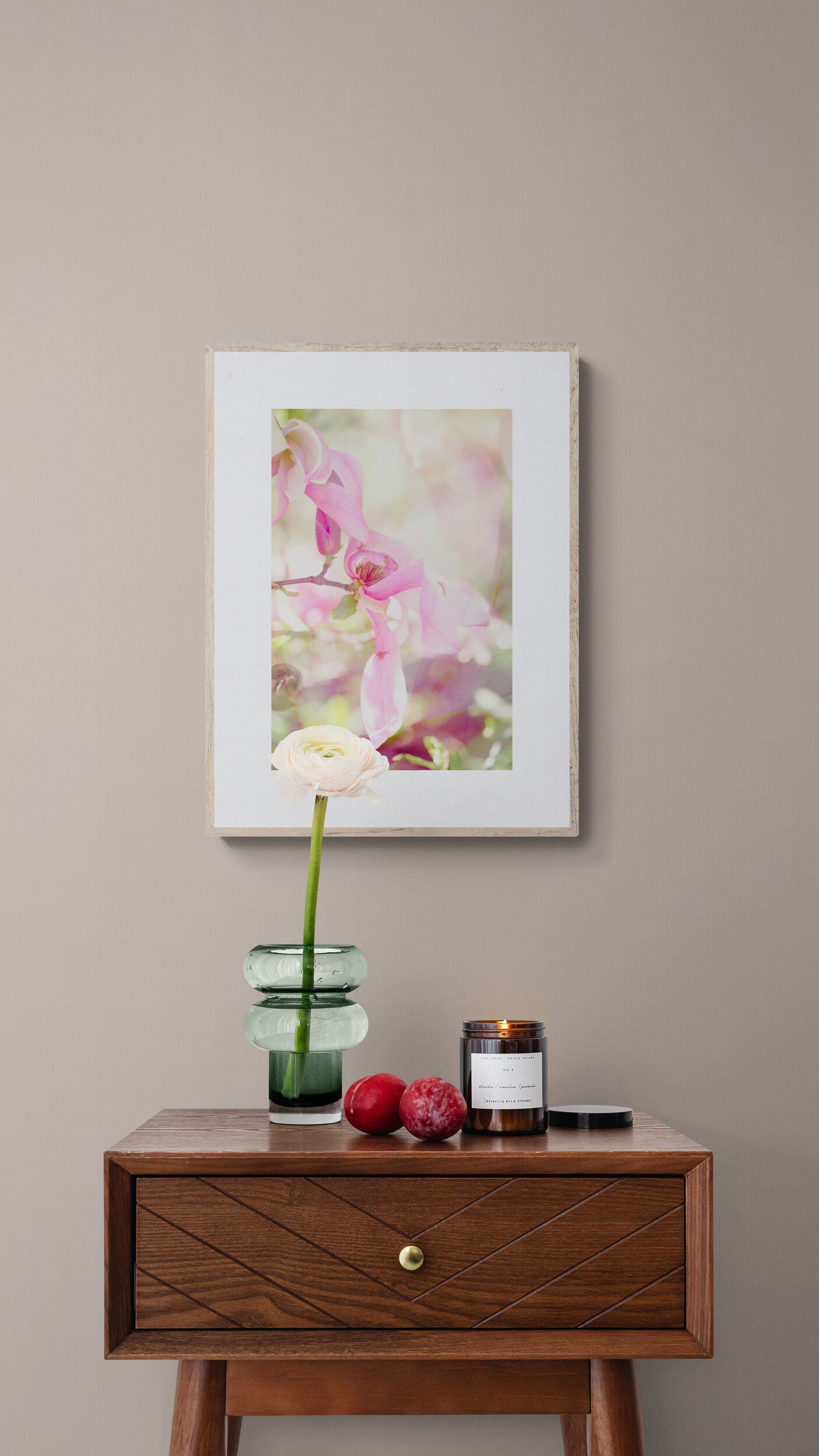 Framed floral photograph as wall art in a living room.