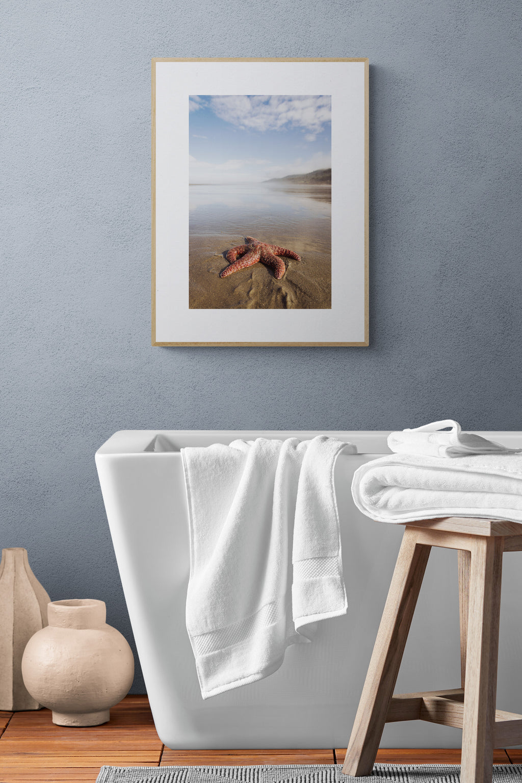 A photograph print in a bathroom of a starfish at kalaloch beach in olympic national park in washington state.