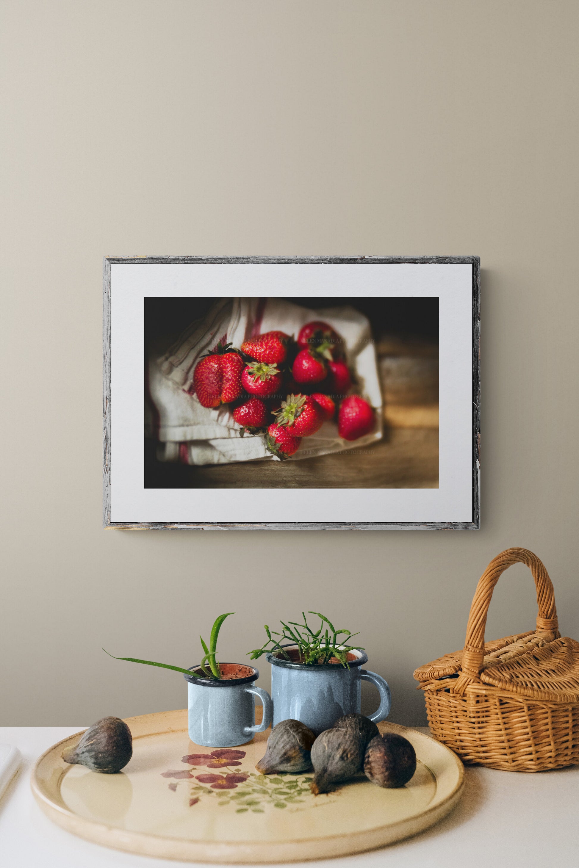 photograph of strawberries as wall art in a kitchen