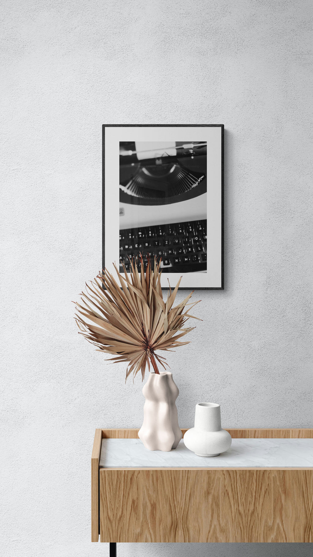 Typewriter photograph in black and white in a living room hallway