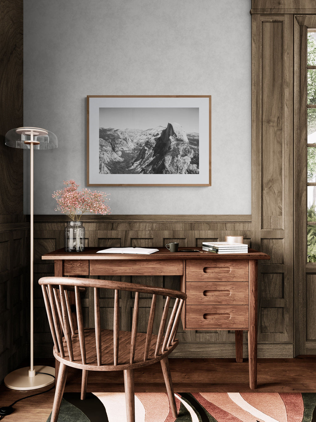 A photograph of Yosemite's Half Dome in an office study.
