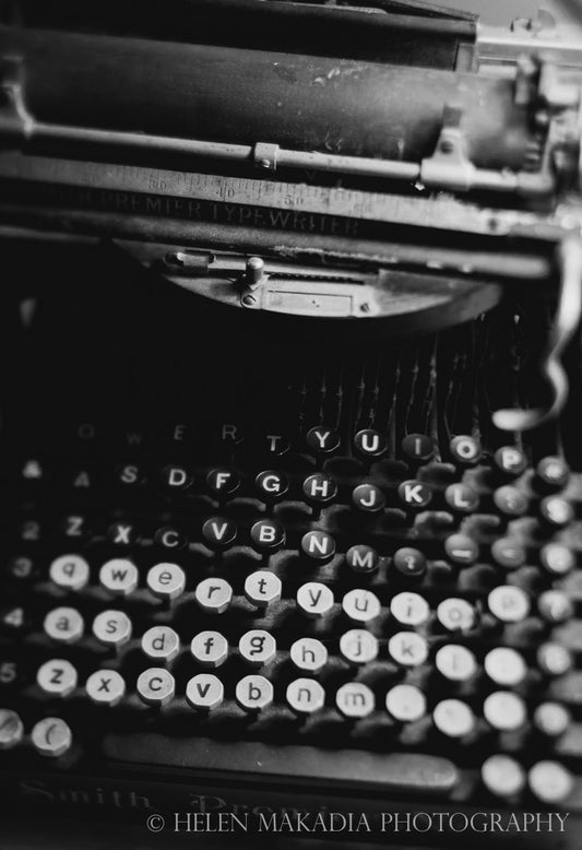 black and white photograph of an antique typewriter