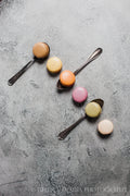 Photograph of Pastel Macarons on Gray