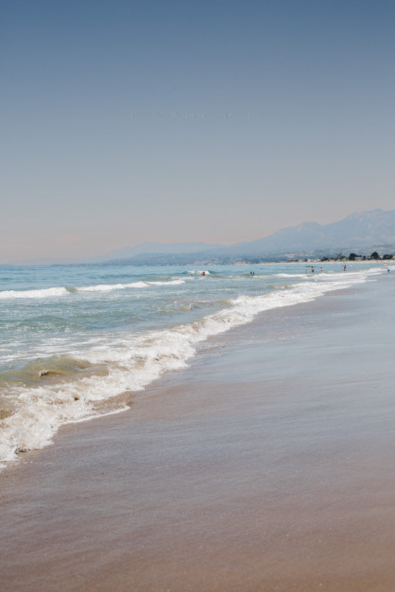 Photograph of Carpinteria Beach in California with Santa Barbara mountains in the background.  