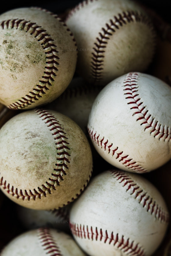 Photograph of worn and loved baseballs as wall art