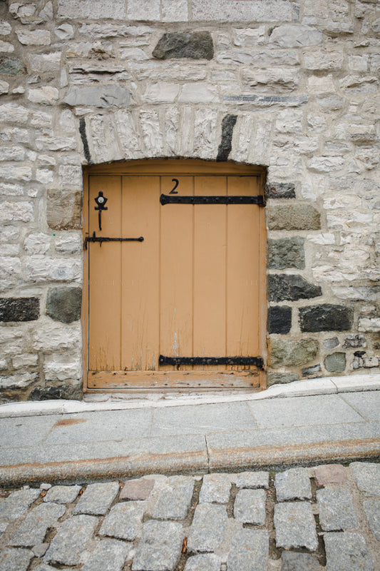 Photograph of a yellow wooden Half Door in Old Quebec CIty Canada 