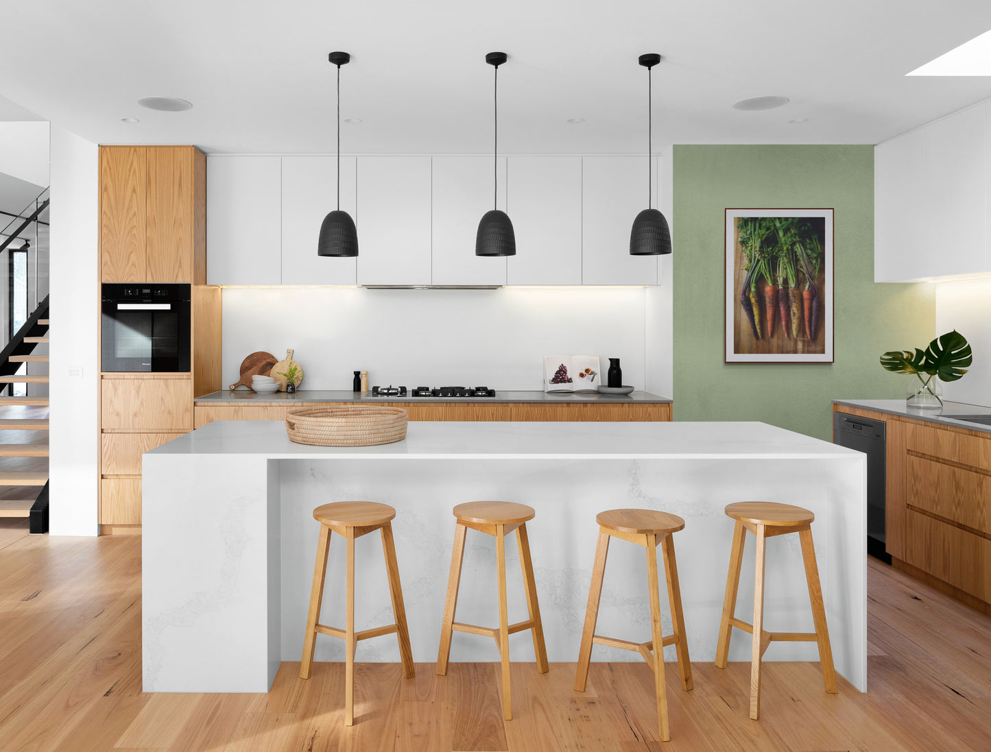 Photograph of colorful carrots in a bright and modern kitchen area