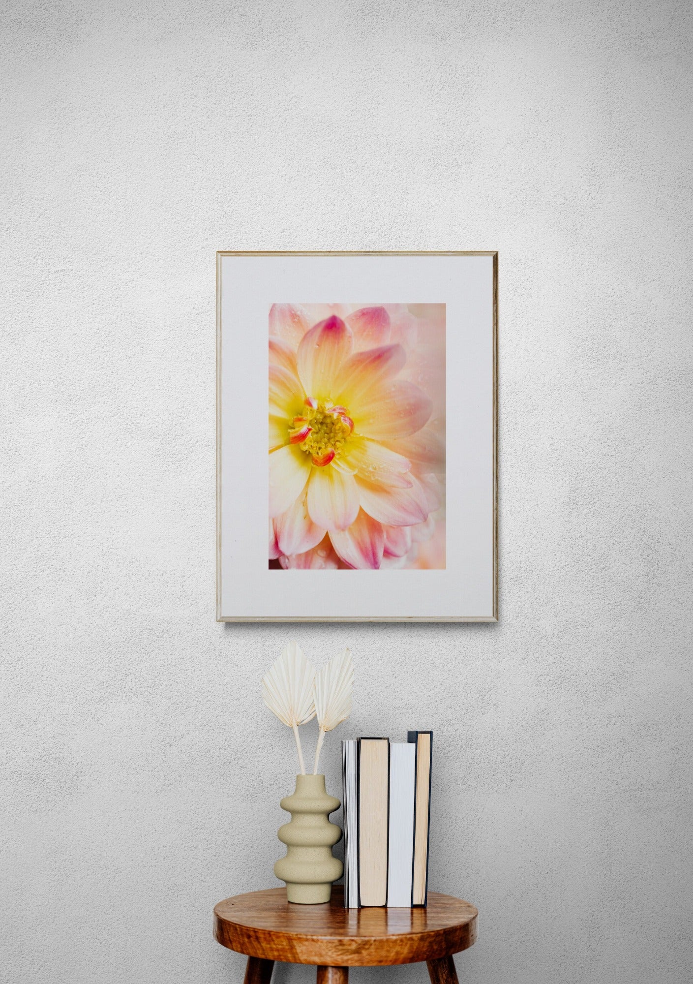 Pink and yellow dahlia photograph print in a hallway as home decor