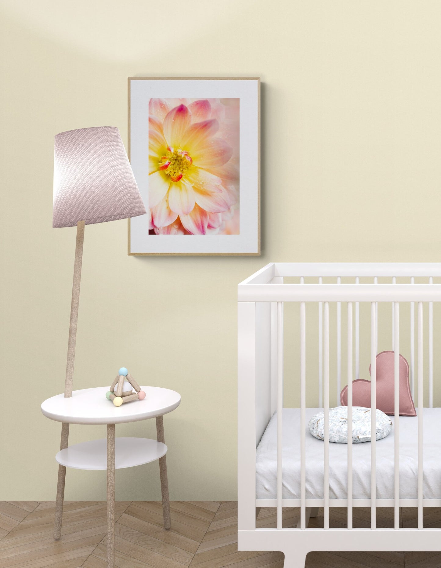 Pink and yellow dahlia photograph print in a nursery as wall art