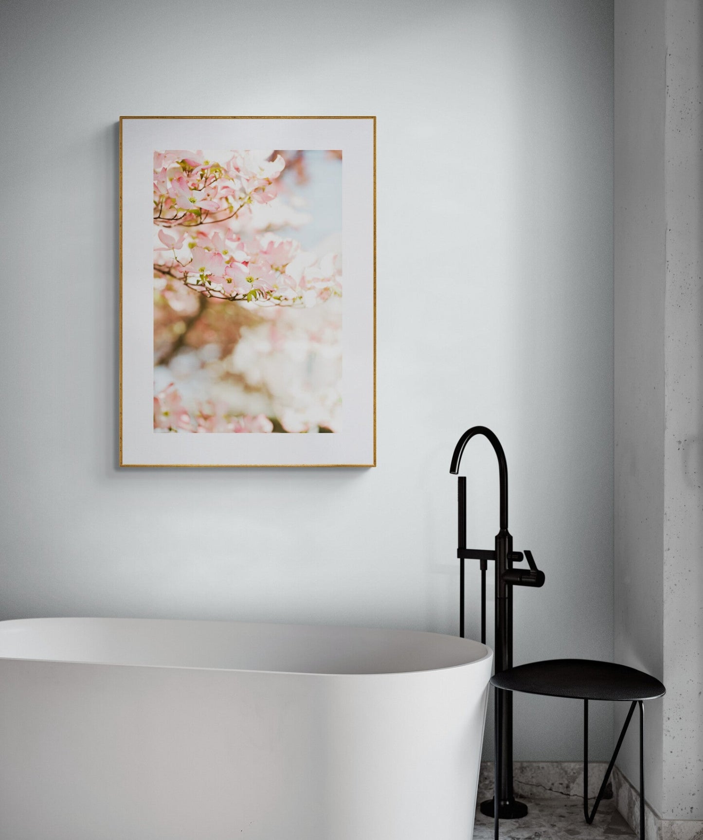 Pink dogwood blooms photograph as wall art in a bathroom