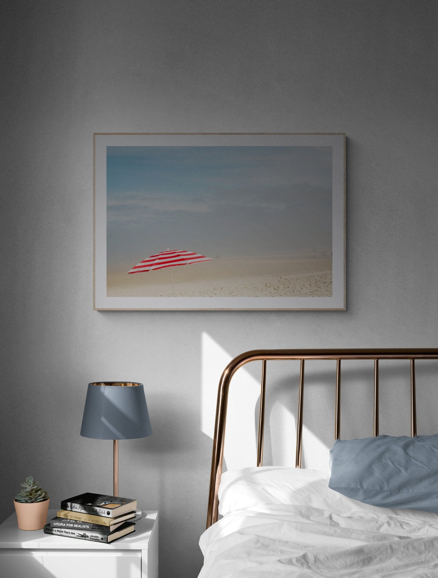 Red and white beach umbrella photograph as bedroom wall art