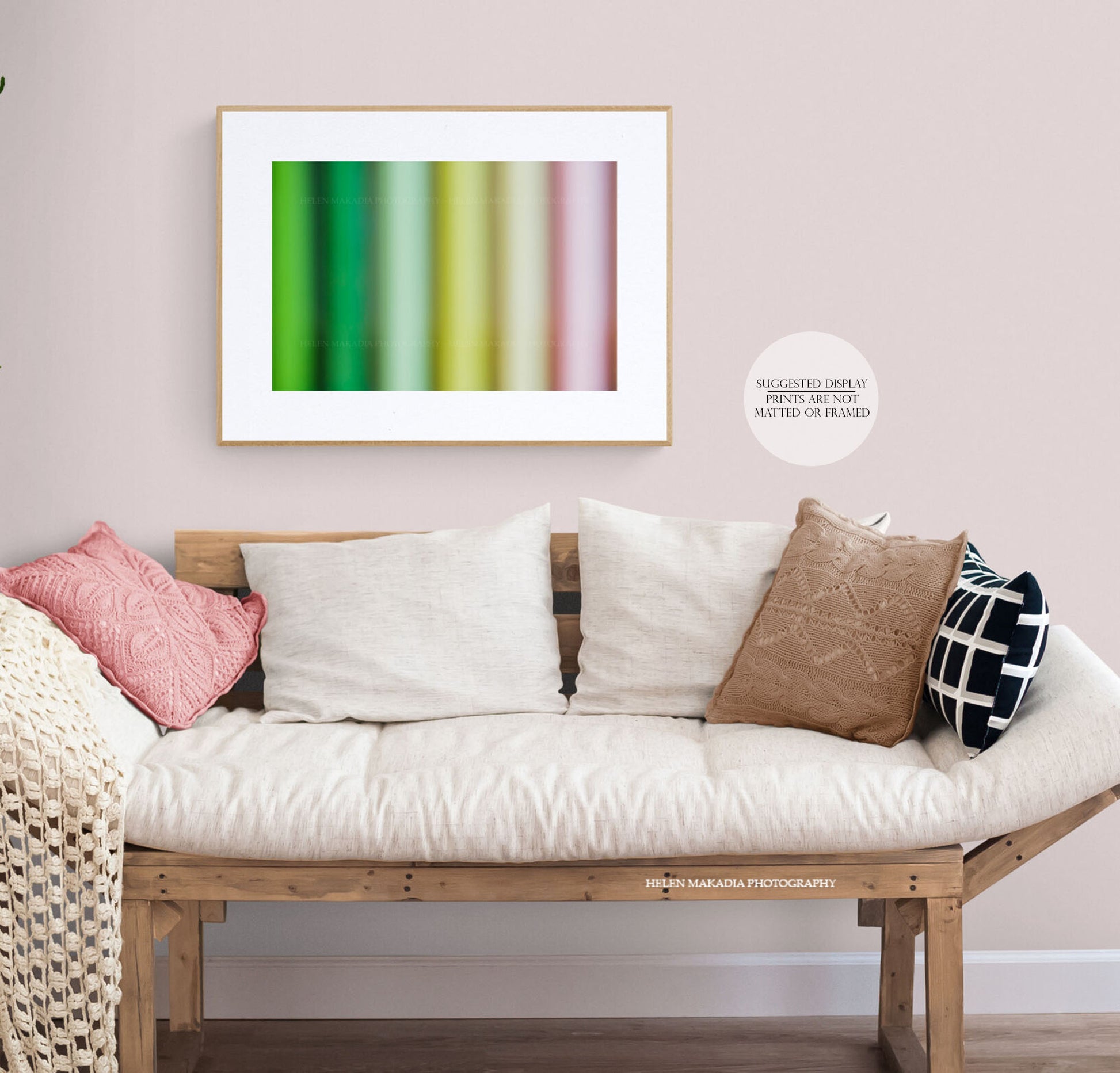 A colorful abstract print of spring colors palette, framed in a sitting room. 
