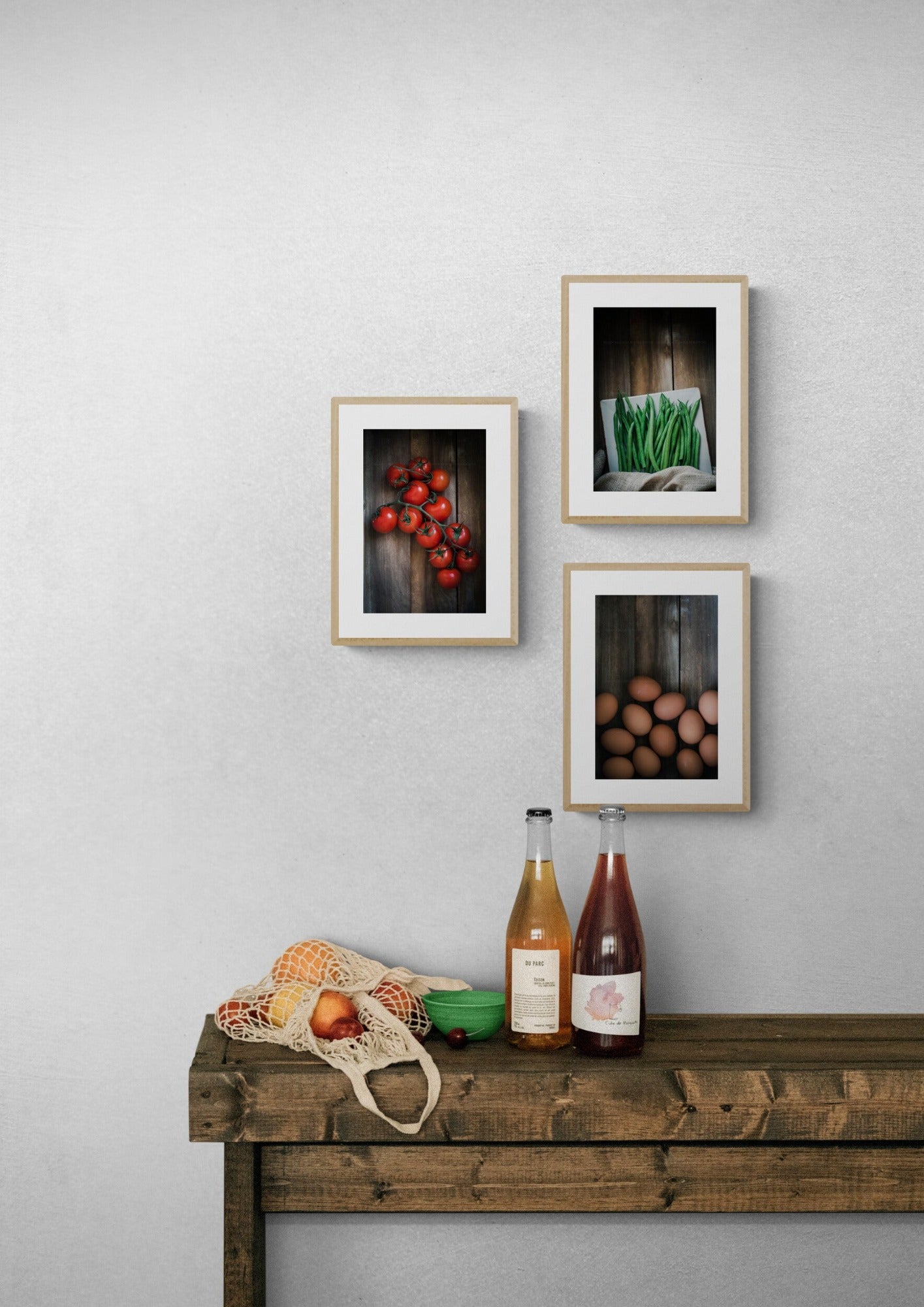Three food photographs as wall prints in a kitchen