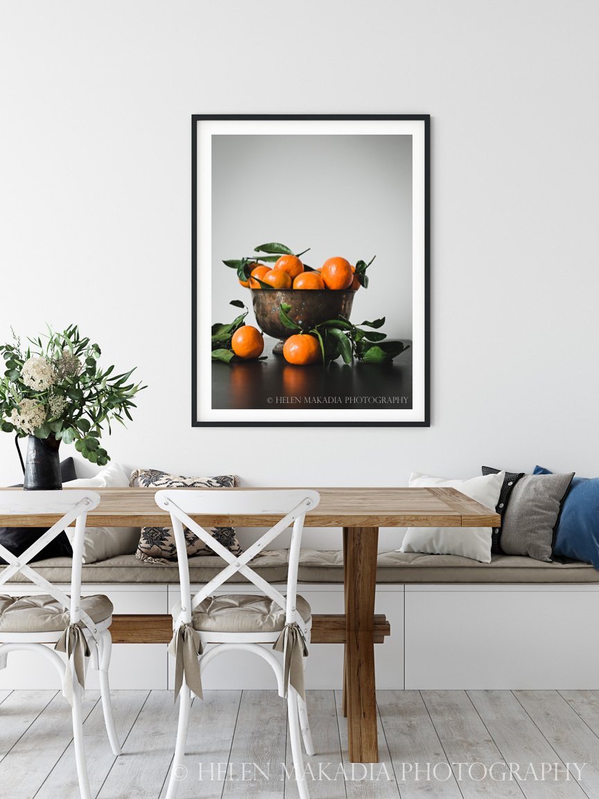A bowl of mandarins as art in a kitchen wall