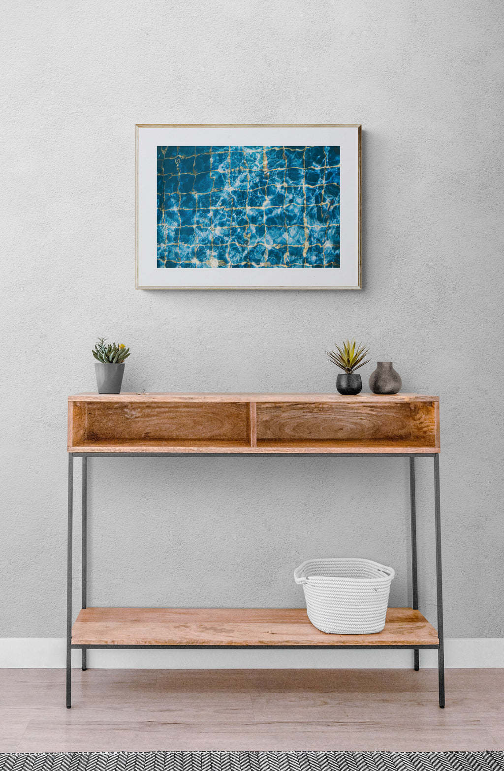 blue swimming pool waters photograph print in a beach house entryway